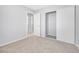 Neutral bedroom with carpet, closet, and a doorway to another room at 100 Grandview Dr, Henderson, NV 89002
