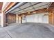 The interior of a spacious, partially finished garage at 100 Grandview Dr, Henderson, NV 89002