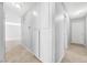 Hallway featuring neutral walls and carpet, with convenient built-in storage at 100 Grandview Dr, Henderson, NV 89002