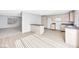 Open kitchen featuring wood-look flooring, neutral cabinets, and stainless appliances at 100 Grandview Dr, Henderson, NV 89002