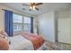 Comfortable bedroom with stylish decor, bright windows, and cozy bedding at 10466 Smokewood Rd, Las Vegas, NV 89135