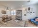 Dining room with modern decor, wood floors, and ample natural light at 10466 Smokewood Rd, Las Vegas, NV 89135