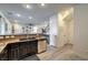 Modern kitchen with stainless steel appliances, dark cabinetry, and granite countertops at 10466 Smokewood Rd, Las Vegas, NV 89135