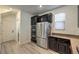 Kitchen with stainless steel appliances, dark cabinets, and modern finishes at 10466 Smokewood Rd, Las Vegas, NV 89135