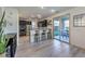 Modern kitchen with stainless steel appliances, dark cabinets, and a breakfast bar at 10466 Smokewood Rd, Las Vegas, NV 89135