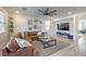 Open-concept living room showcases a large leather sectional, modern decor, and a stylish accent wall at 10466 Smokewood Rd, Las Vegas, NV 89135