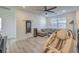 Bright living room featuring light wood floors, neutral colors and lots of natural light at 10466 Smokewood Rd, Las Vegas, NV 89135