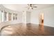 Spacious primary bedroom with wood floors, ceiling fan, and lots of natural light at 11125 Twilight Times Ct, Las Vegas, NV 89135