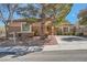 Charming single-story home featuring desert landscaping and a welcoming facade at 11125 Twilight Times Ct, Las Vegas, NV 89135