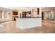 Open-concept kitchen with large island, granite counters, and seamlessly adjoined dining area at 11125 Twilight Times Ct, Las Vegas, NV 89135