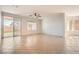 Bright, airy living room featuring tile flooring and a sliding glass door at 11125 Twilight Times Ct, Las Vegas, NV 89135