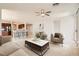 Bright, open living room featuring stylish furniture, ceiling fan and seamless flow into the kitchen at 11125 Twilight Times Ct, Las Vegas, NV 89135