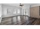 Bright bedroom with hardwood floors, shuttered windows, ceiling fan, and built in storage at 11775 Woodbrook Ct, Las Vegas, NV 89141