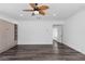 Spacious bedroom featuring hardwood floors, ceiling fan, and built in storage at 11775 Woodbrook Ct, Las Vegas, NV 89141