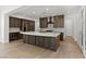 Spacious kitchen features a large island, stainless steel appliances, and lots of cabinets at 11775 Woodbrook Ct, Las Vegas, NV 89141