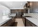 Modern kitchen boasts stainless steel appliances, custom cabinetry, and sleek countertops for culinary enthusiasts at 11775 Woodbrook Ct, Las Vegas, NV 89141