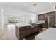 Gourmet kitchen with island, custom cabinets, and stone farmhouse sink; ideal for cooking and entertaining at 11775 Woodbrook Ct, Las Vegas, NV 89141