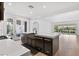 Bright open kitchen featuring a large island, stainless steel appliances, and seamless access to the outdoors at 11775 Woodbrook Ct, Las Vegas, NV 89141