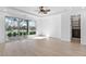 Bright main bedroom featuring wood floors and sliding glass doors with golf course views at 11775 Woodbrook Ct, Las Vegas, NV 89141