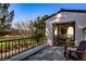 Outdoor patio with wrought iron railing overlooking a golf course and mountain views at 11775 Woodbrook Ct, Las Vegas, NV 89141