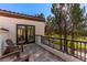 Outdoor patio with golf course views, comfortable seating, and tile flooring at 11775 Woodbrook Ct, Las Vegas, NV 89141