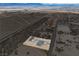 Aerial view of new home in desert community at 1330 W Gee St, Pahrump, NV 89060