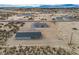 Expansive aerial view of a desert home with detached garage offering wide open spaces at 1330 W Gee St, Pahrump, NV 89060