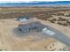 Panoramic drone image shows new home and detached garage set against a desert landscape at 1330 W Gee St, Pahrump, NV 89060