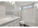 Well-lit bathroom with a tub-shower combination, a white vanity, and a clean, modern design at 1330 W Gee St, Pahrump, NV 89060