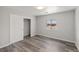 Bright bedroom boasts wood-look flooring, a large window, and a spacious closet at 1330 W Gee St, Pahrump, NV 89060