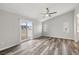Bright bedroom featuring sliding glass doors, neutral walls and wood flooring at 1330 W Gee St, Pahrump, NV 89060