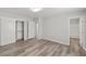 Spacious bedroom with a large closet, wood-look floors, and ensuite bathroom entrance at 1330 W Gee St, Pahrump, NV 89060