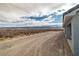 Wide desert driveway leads to home and offers picturesque views of the surrounding scenery at 1330 W Gee St, Pahrump, NV 89060