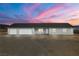 Single-story home featuring multiple garages and easy care landscaping at 1330 W Gee St, Pahrump, NV 89060