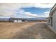 Exterior shot of the house with a two-car garage, surrounded by a gravel yard at 1330 W Gee St, Pahrump, NV 89060