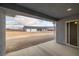 Exterior shot of the house from the patio, with a view of the mountains in the background at 1330 W Gee St, Pahrump, NV 89060