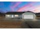 Charming single-story home with large garage and gravel landscaping at 1330 W Gee St, Pahrump, NV 89060