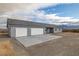 Attractive single-story home with a two-car garage and concrete driveway, set under a partly cloudy sky at 1330 W Gee St, Pahrump, NV 89060