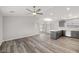 Spacious, open-concept living area features abundant natural light and wood-look floors at 1330 W Gee St, Pahrump, NV 89060