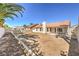 Large, private backyard with block wall, ready for landscaping and outdoor enjoyment at 1665 Rowan Tree Dr, Las Vegas, NV 89123