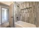 Stylish bathroom showcasing a tiled shower and tub combination with modern fixtures at 1665 Rowan Tree Dr, Las Vegas, NV 89123