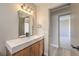 Modern bathroom featuring a floating vanity with a white countertop and wood cabinets at 1665 Rowan Tree Dr, Las Vegas, NV 89123
