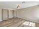 Bedroom featuring wood-look floors and a neutral color scheme at 1665 Rowan Tree Dr, Las Vegas, NV 89123