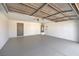 Spacious garage with painted floor and water heater; ready for vehicles and storage at 1665 Rowan Tree Dr, Las Vegas, NV 89123