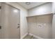 Functional laundry room with shelving and utility hookups at 1665 Rowan Tree Dr, Las Vegas, NV 89123