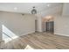 Spacious living room featuring wood-look tile floors and ample natural light at 1665 Rowan Tree Dr, Las Vegas, NV 89123