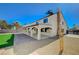 Home exterior shows covered patio, artificial turf, and gravel landscaping at 1904 Roxbury Ln, Las Vegas, NV 89119