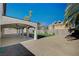 Spacious backyard features a large covered patio, artificial grass and stone landscaping at 1904 Roxbury Ln, Las Vegas, NV 89119