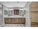 Bathroom with double vanity, modern vessel sinks, and a view to the glass-enclosed shower at 1904 Roxbury Ln, Las Vegas, NV 89119