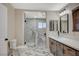 Bathroom showcases marble-look flooring, toilet, shower, and double sink vanity with modern fixtures at 1904 Roxbury Ln, Las Vegas, NV 89119